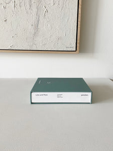 Book titled Less and More: The Design Ethos of Dieter Rams sitting on a white countertop