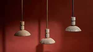 a trio of Rosie Li and Mondays ceramic round pendant hanging lights