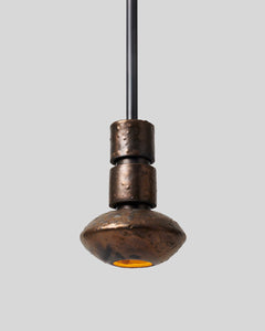 Rosie Li and Mondays ceramic tiered saucer pendant light hanging in umber bronze and oil-rubbed bronze
