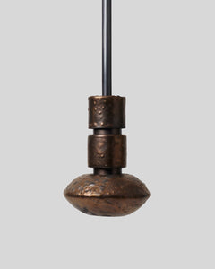 Rosie Li and Mondays ceramic tiered saucer pendant light hanging in umber bronze and oil-rubbed bronze