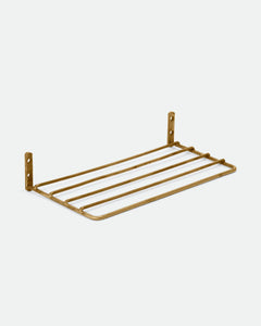brass wire shelf shown at an angle