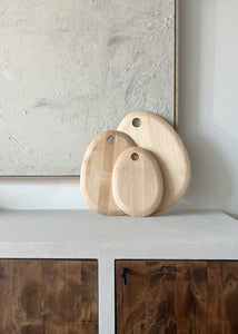 Organically shaped round maple cutting boards - available in three sizes.